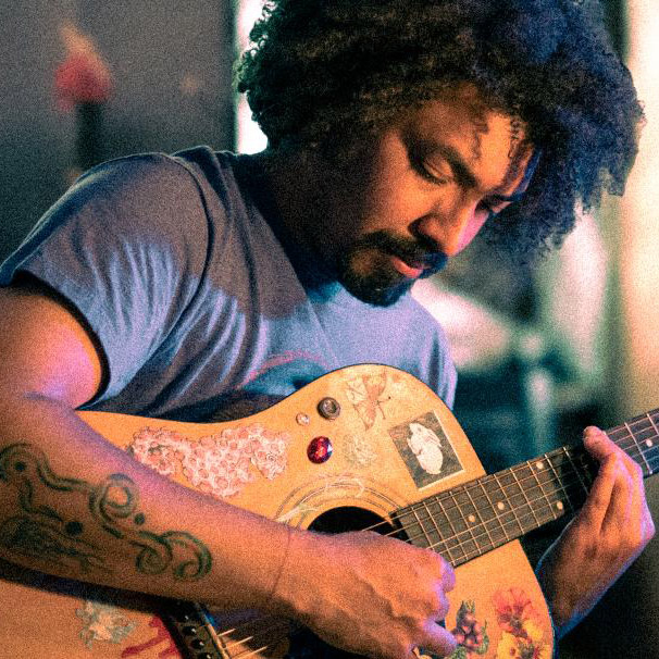 Tevin playing guitar.